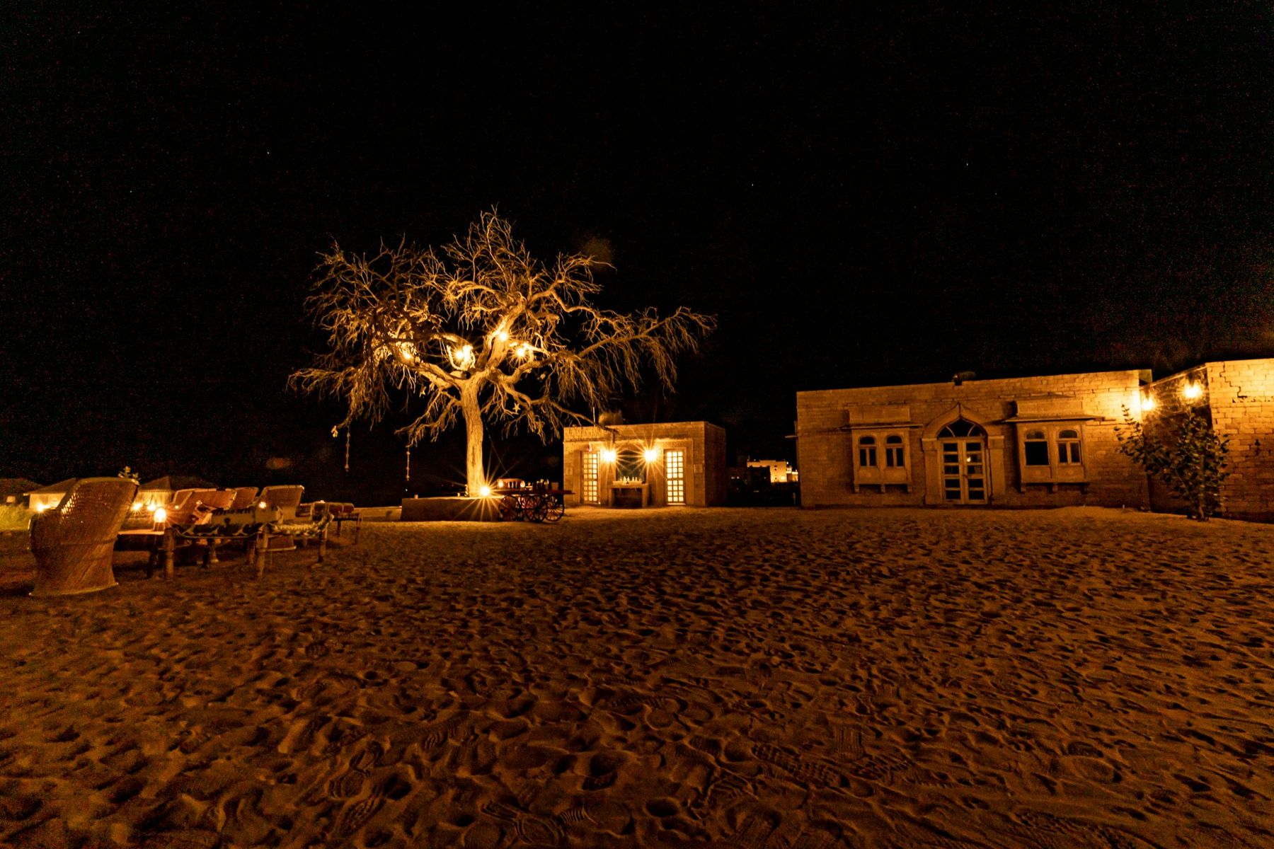 Heritage hotel courtyard in India lit at night