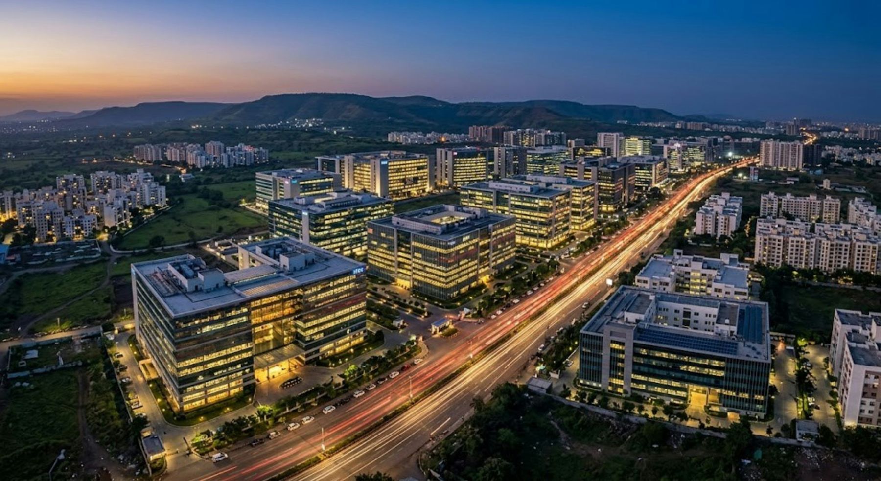 Aerial view of a modern business park and highway in an Indian city